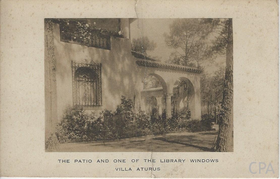 THE PATIO AND ONE OF THE LIBRARY WINDOWS VILLA ATURUS